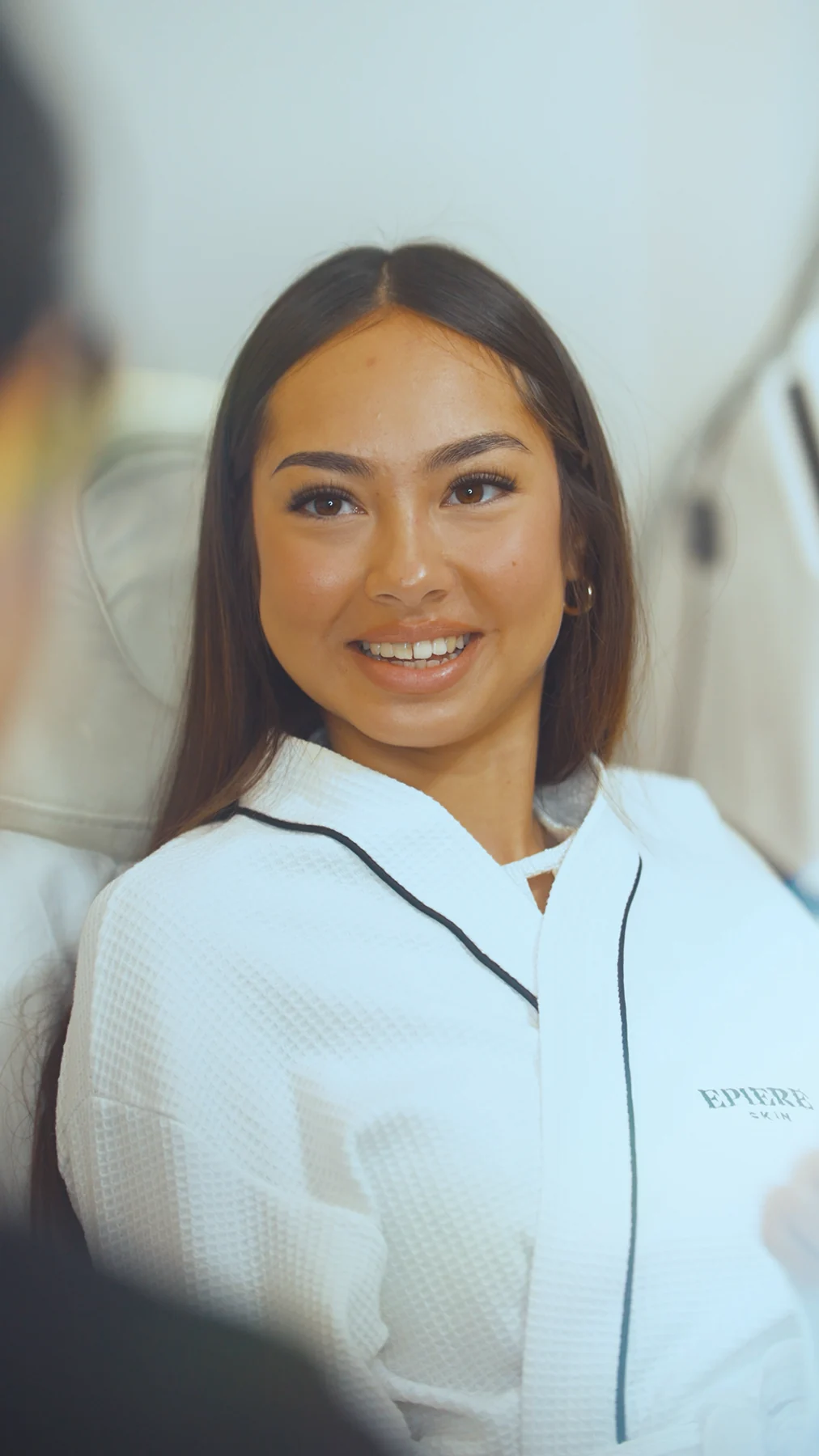 Epiere Skin client in a branded treatment robe