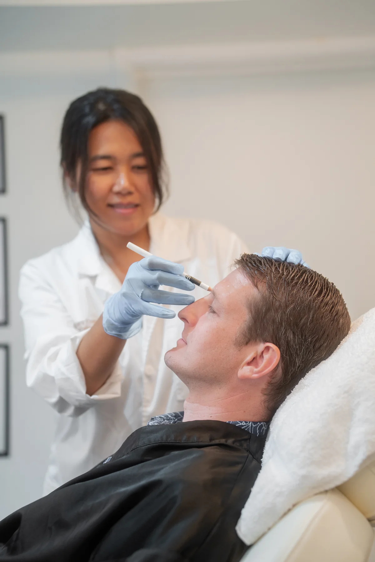 Skin Care Essentials practitioner carrying out a consultation